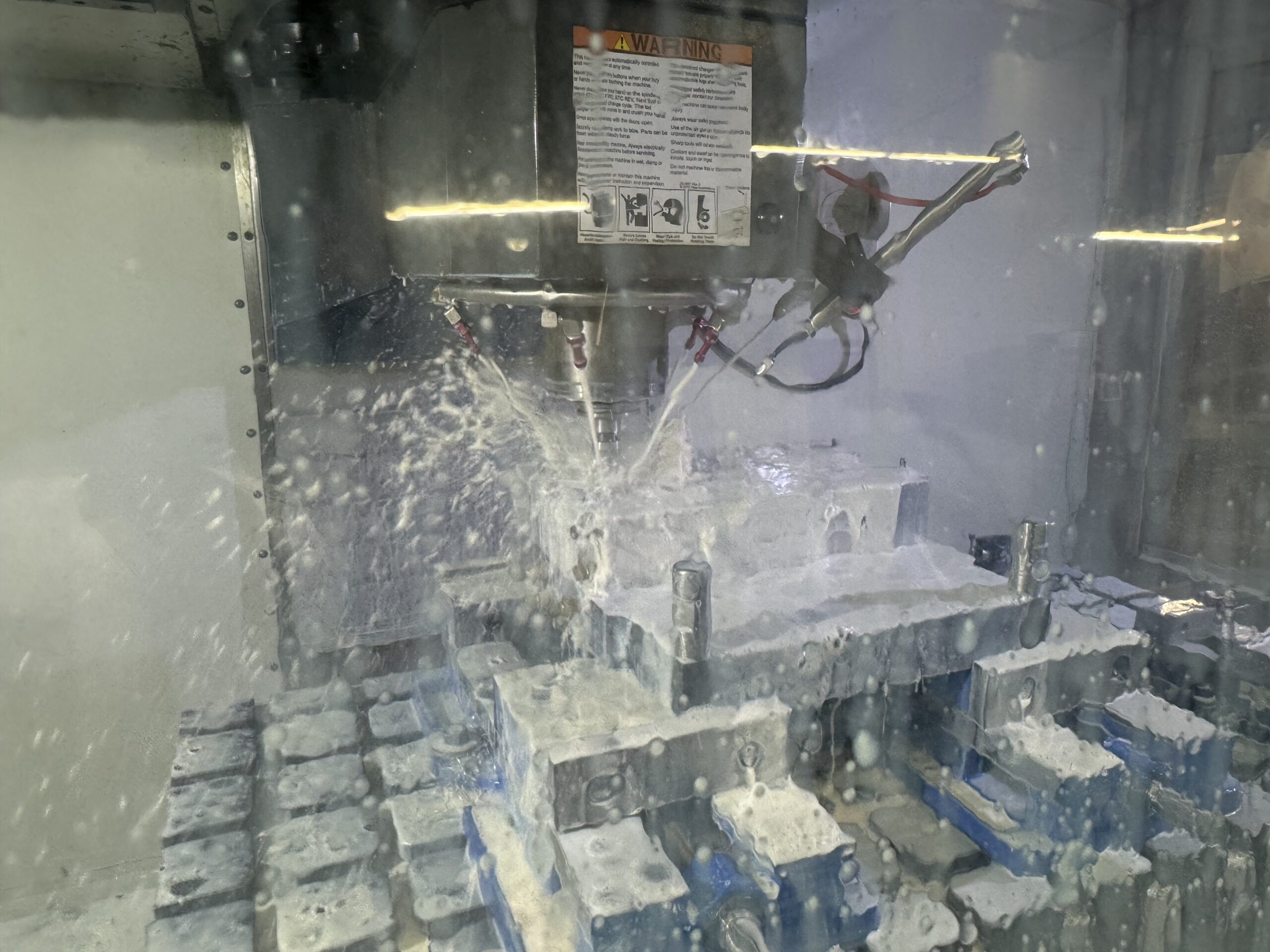 CNC machine milling a mold cavity