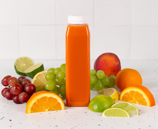 12 oz cold pressed juice bottle filled with orange beverage