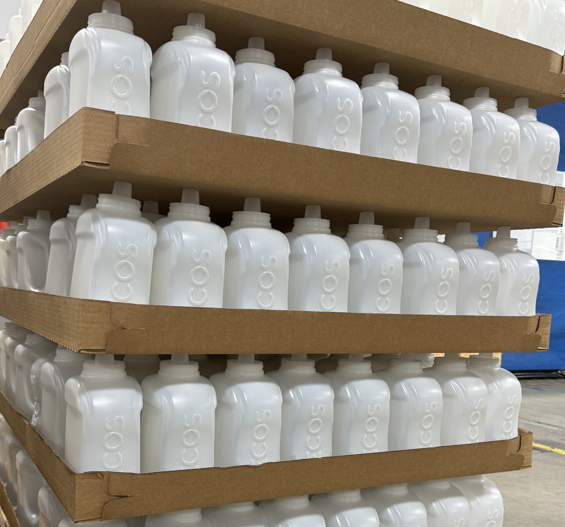 plastic bottles packed on trays